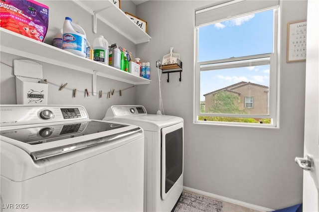 2672 Painted Mist Ct, Las Vegas, NV 89142 - laundry room featuring independent washer and dryer, plenty of natural light, and baseboards