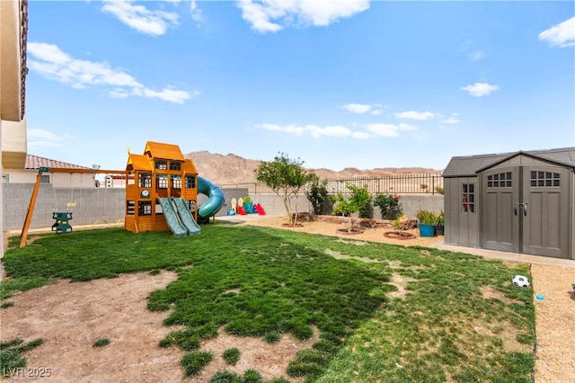 2672 Painted Mist Ct, Las Vegas, NV 89142 - view of yard featuring a playground, a storage shed, and an outdoor structure