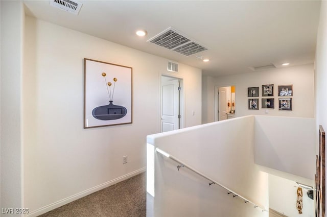 hallway with an upstairs landing, carpet flooring, recessed lighting, and baseboards