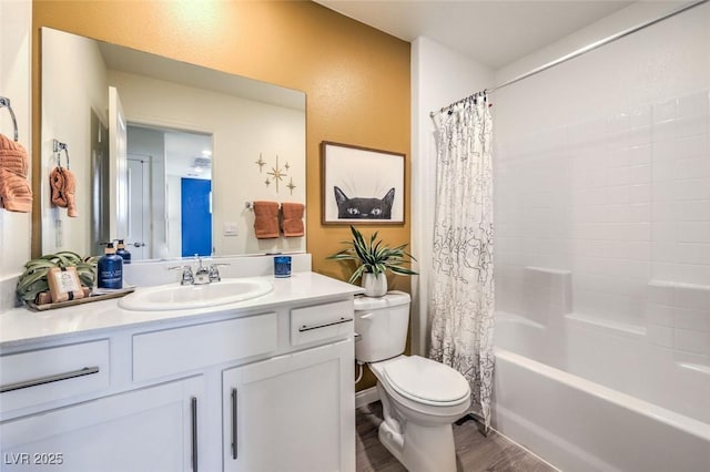 full bathroom featuring toilet, wood finished floors, vanity, and shower / bath combination with curtain
