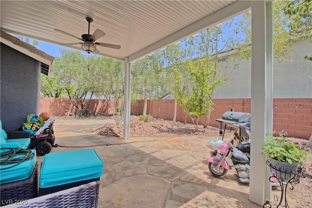 view of patio featuring a ceiling fan, a fenced backyard, and a grill