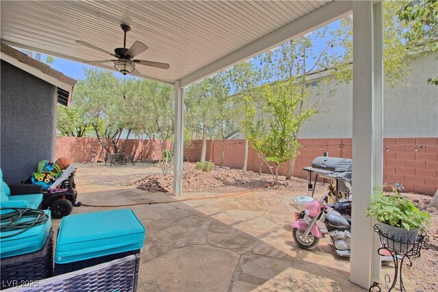 7728 Whispering River St, Las Vegas, NV 89131 - fenced backyard with a ceiling fan and a patio