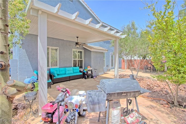 view of patio / terrace with ceiling fan, an outdoor hangout area, and fence