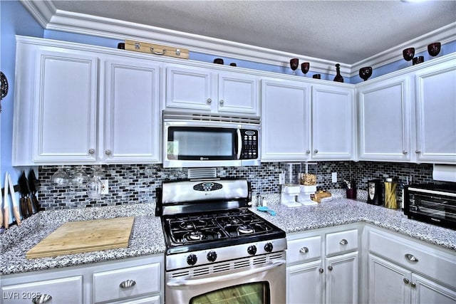 7728 Whispering River St, Las Vegas, NV 89131 - kitchen with stainless steel appliances, white cabinetry, tasteful backsplash, and ornamental molding