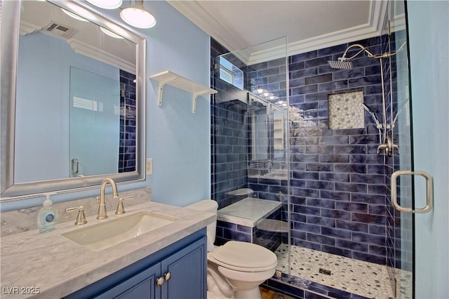full bath with ornamental molding, a shower stall, vanity, and toilet