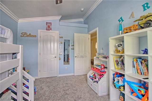 rec room featuring crown molding, carpet, and baseboards