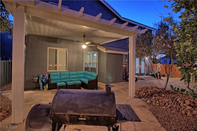 7728 Whispering River St, Las Vegas, NV 89131 - fenced backyard featuring an outdoor hangout area, a patio area, and a ceiling fan