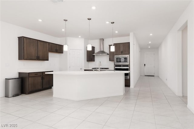 kitchen with wall chimney exhaust hood, stainless steel appliances, dark brown cabinets, light countertops, and recessed lighting