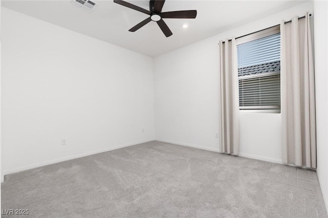 carpeted empty room featuring ceiling fan, baseboards, and recessed lighting