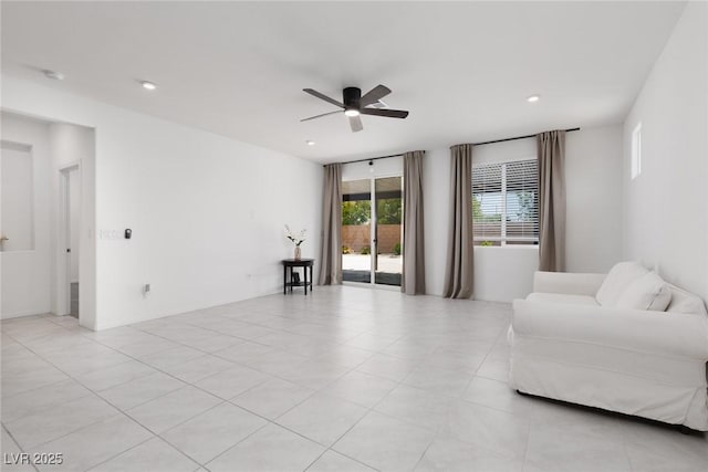 living area featuring a ceiling fan and recessed lighting