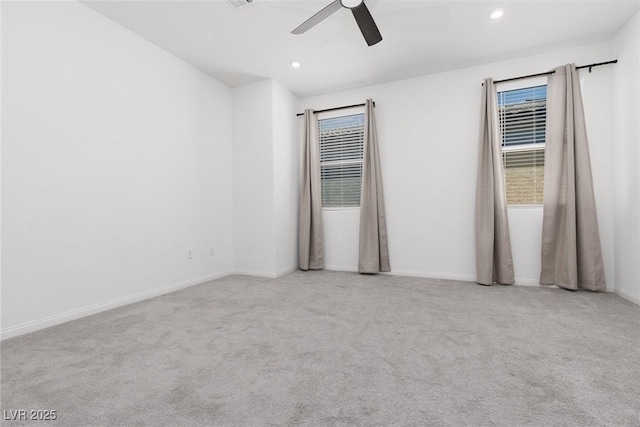 carpeted spare room featuring ceiling fan, recessed lighting, and baseboards