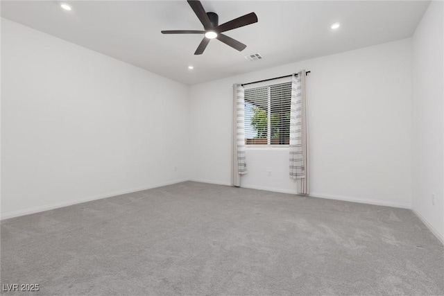 carpeted spare room with a ceiling fan, recessed lighting, and baseboards