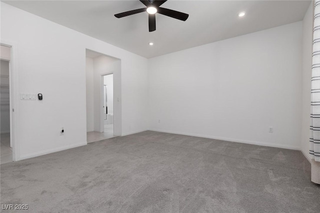 carpeted empty room featuring ceiling fan, recessed lighting, and baseboards
