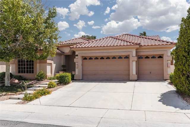 3522 Shonna Way N, Las Vegas, NV 89032 - mediterranean / spanish-style house with a garage, stucco siding, concrete driveway, and a tile roof