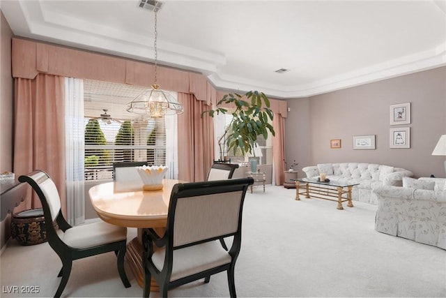 3522 Shonna Way N, Las Vegas, NV 89032 - dining room with a tray ceiling, carpet, and a chandelier