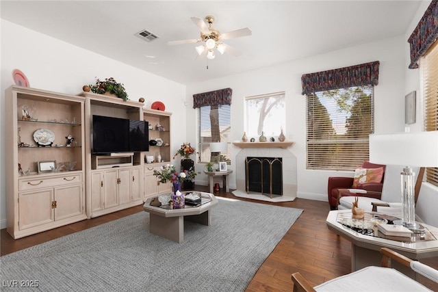 3522 Shonna Way N, Las Vegas, NV 89032 - living area featuring ceiling fan, dark wood-style floors, and a tile fireplace