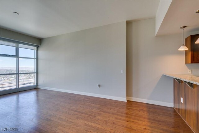 150 Las Vegas Blvd Unit 2003, Las Vegas, NV 89101 - spare room featuring dark wood-type flooring and baseboards