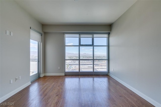 150 Las Vegas Blvd Unit 2003, Las Vegas, NV 89101 - spare room with dark wood-style floors and baseboards
