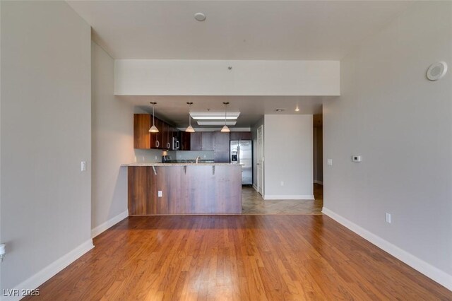 150 Las Vegas Blvd Unit 2003, Las Vegas, NV 89101 - unfurnished living room featuring light wood-style floors and baseboards