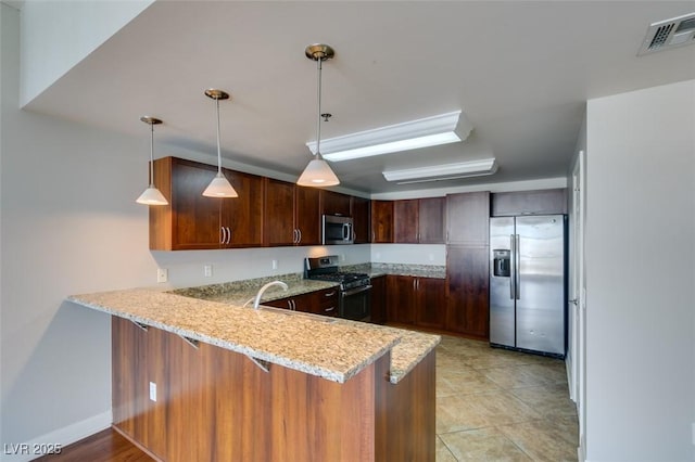 150 Las Vegas Blvd Unit 2003, Las Vegas, NV 89101 - kitchen featuring appliances with stainless steel finishes, a peninsula, light stone countertops, pendant lighting, and a sink
