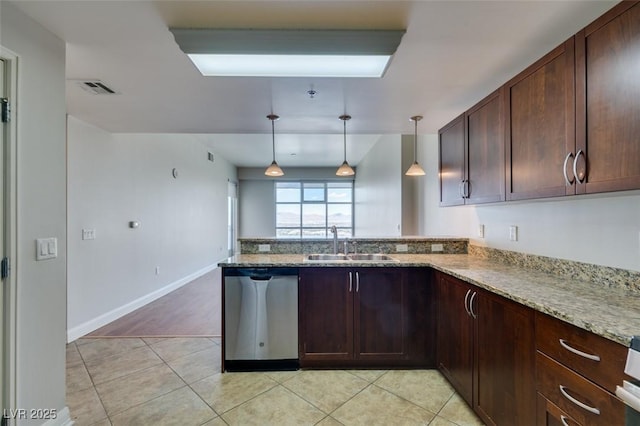 150 Las Vegas Blvd Unit 2003, Las Vegas, NV 89101 - kitchen featuring dishwasher, a sink, a peninsula, light tile patterned floors, and light stone countertops