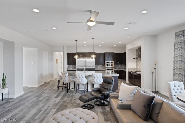 11088 Westcroft Way, Las Vegas, NV 89183 - living area with a ceiling fan, recessed lighting, light wood-style floors, and baseboards