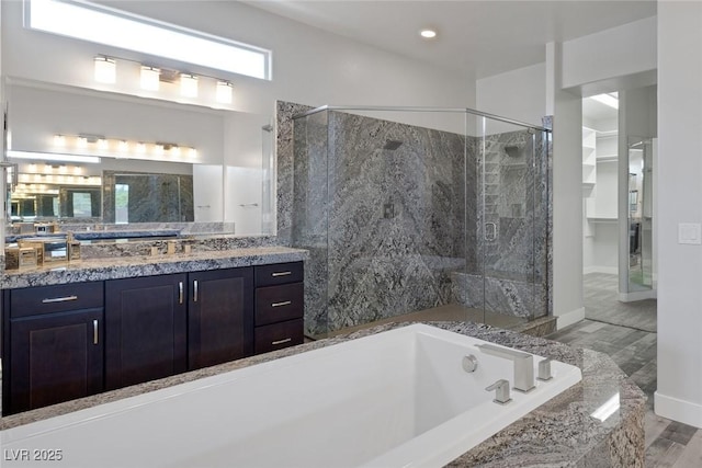 11088 Westcroft Way, Las Vegas, NV 89183 - full bathroom with a stall shower, a bath, vanity, baseboards, and recessed lighting