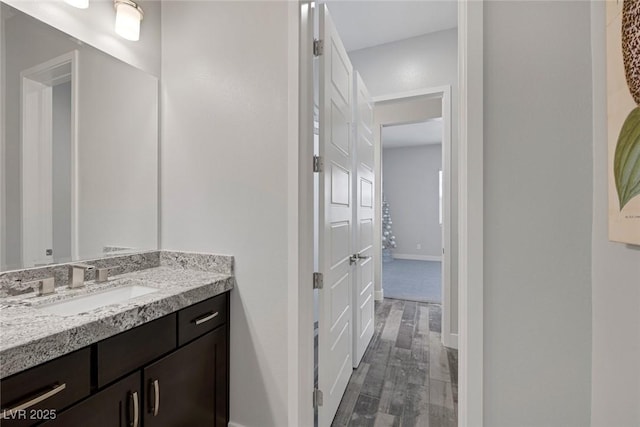 11088 Westcroft Way, Las Vegas, NV 89183 - bathroom with wood finished floors, vanity, and baseboards