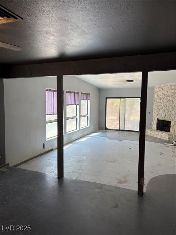 2100 Plaza Del Padre, Las Vegas, NV 89102 - below grade area featuring a stone fireplace