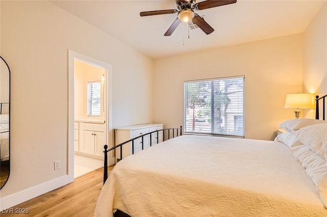 251 S Green Valley Pkwy Unit 1311, Henderson, NV 89012 - bedroom with wood finished floors, baseboards, ensuite bathroom, and ceiling fan