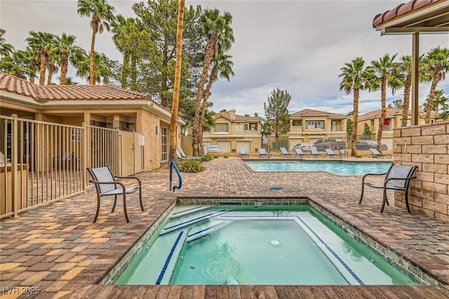 251 S Green Valley Pkwy Unit 1311, Henderson, NV 89012 - community pool with a community hot tub, a patio, and fence