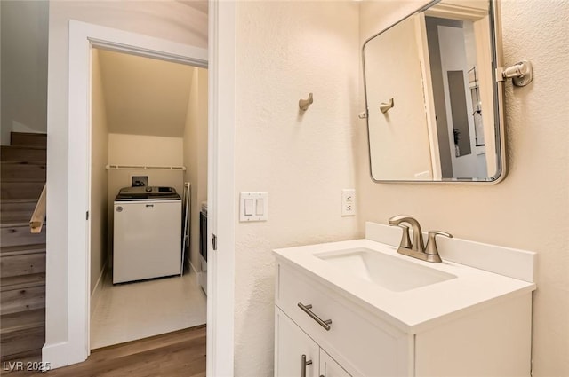 251 S Green Valley Pkwy Unit 1311, Henderson, NV 89012 - bathroom with vanity, wood finished floors, and washer and dryer