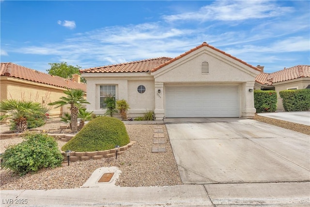7929 Ben Hogan Dr, Las Vegas, NV 89149 - mediterranean / spanish home featuring stucco siding, an attached garage, concrete driveway, and a tile roof