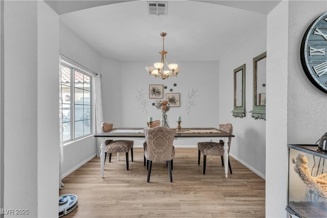 7929 Ben Hogan Dr, Las Vegas, NV 89149 - dining space with a chandelier, light wood-type flooring, and baseboards