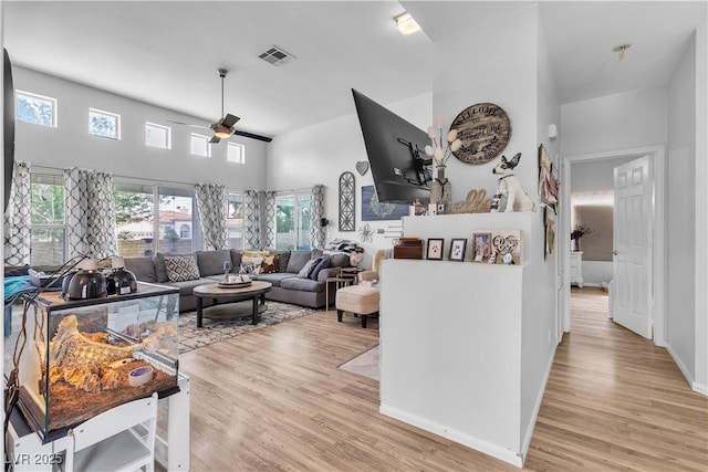 7929 Ben Hogan Dr, Las Vegas, NV 89149 - living area with ceiling fan, light wood-style floors, and baseboards