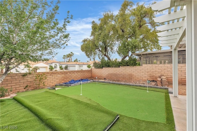 7929 Ben Hogan Dr, Las Vegas, NV 89149 - fenced backyard with a putting area