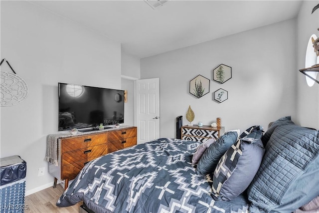 7929 Ben Hogan Dr, Las Vegas, NV 89149 - bedroom featuring light wood-style floors and baseboards