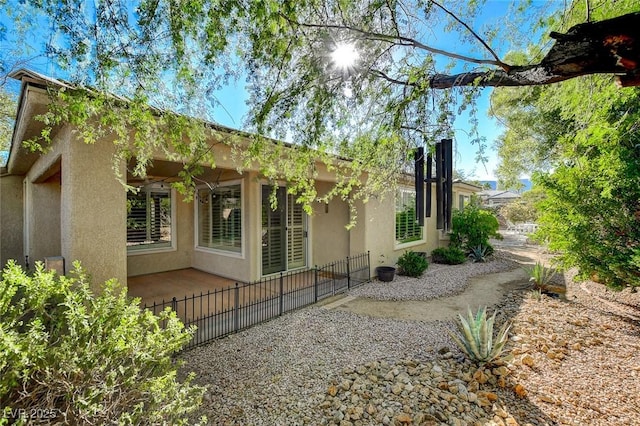 10302 Cara Mia Ct, Las Vegas, NV 89135 - view of property exterior featuring stucco siding and fence