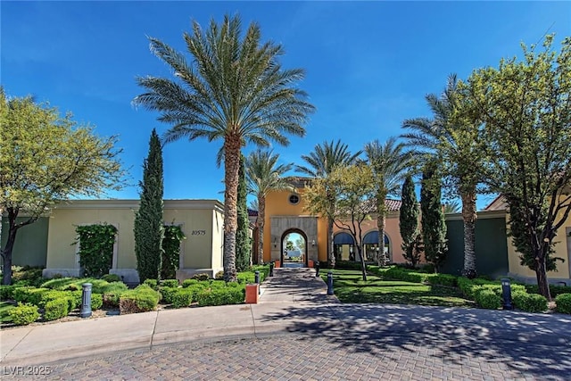 10302 Cara Mia Ct, Las Vegas, NV 89135 - view of front of house featuring stucco siding and driveway