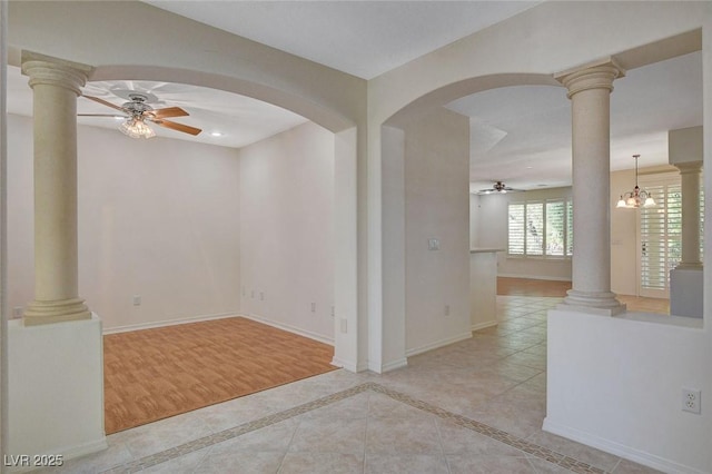 10302 Cara Mia Ct, Las Vegas, NV 89135 - spare room featuring ceiling fan, baseboards, arched walkways, and ornate columns