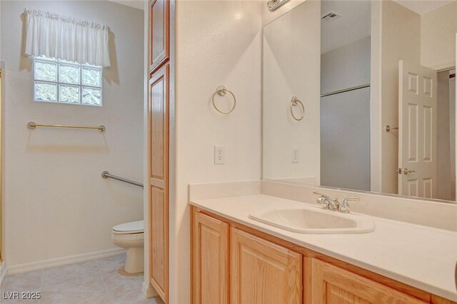 10302 Cara Mia Ct, Las Vegas, NV 89135 - bathroom with toilet, vanity, tile patterned flooring, and baseboards