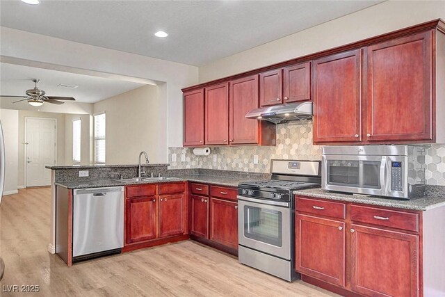 248 Windmill Croft Dr, Las Vegas, NV 89148 - kitchen with stainless steel appliances, dark brown cabinets, a sink, and recessed lighting