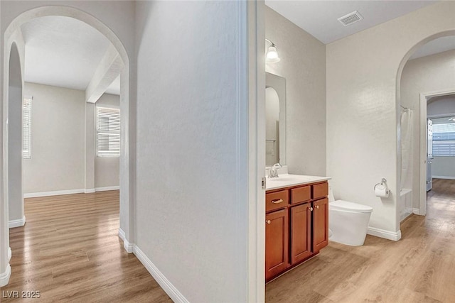 248 Windmill Croft Dr, Las Vegas, NV 89148 - full bathroom featuring wood finished floors, toilet, vanity, and baseboards