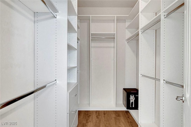 248 Windmill Croft Dr, Las Vegas, NV 89148 - spacious closet featuring wood finished floors