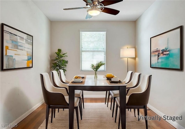 248 Windmill Croft Dr, Las Vegas, NV 89148 - dining room with baseboards, wood finished floors, and ceiling fan