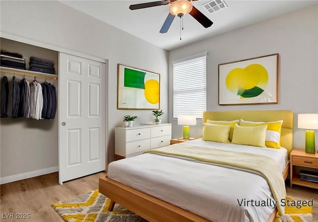 248 Windmill Croft Dr, Las Vegas, NV 89148 - bedroom with wood finished floors, a closet, baseboards, and a ceiling fan