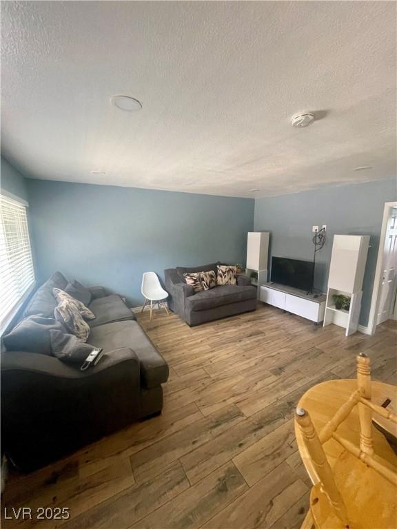 501 S Maryland Pkwy Unit C17, Las Vegas, NV 89101 - living room featuring a textured ceiling and hardwood / wood-style floors