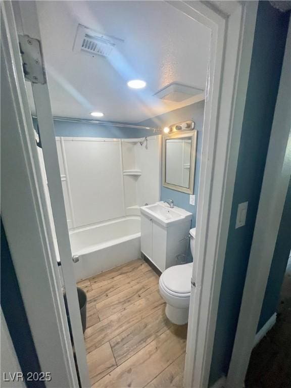 501 S Maryland Pkwy Unit C17, Las Vegas, NV 89101 - bathroom with hardwood / wood-style floors, toilet, vanity, and bathtub / shower combination