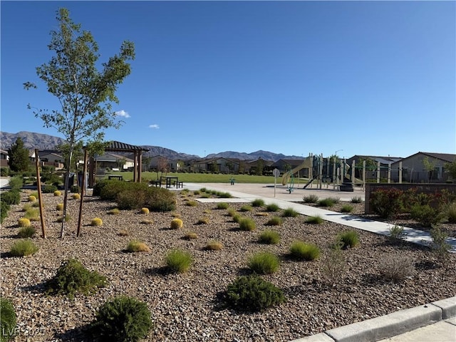 view of mountain backdrop with nearby suburban area