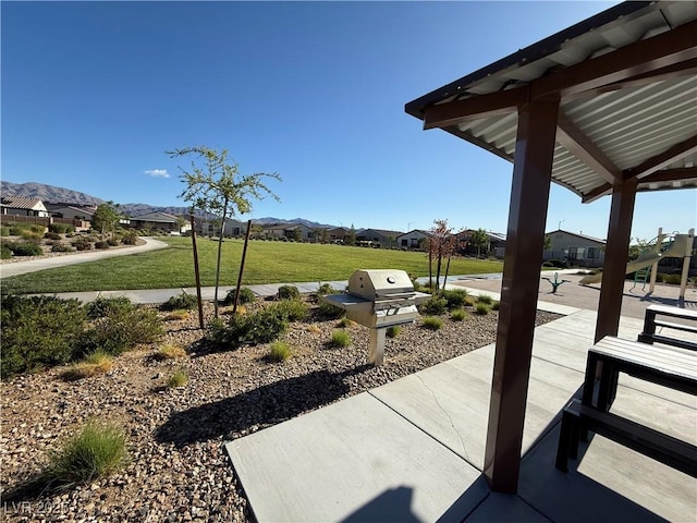 view of patio with area for grilling and a residential view